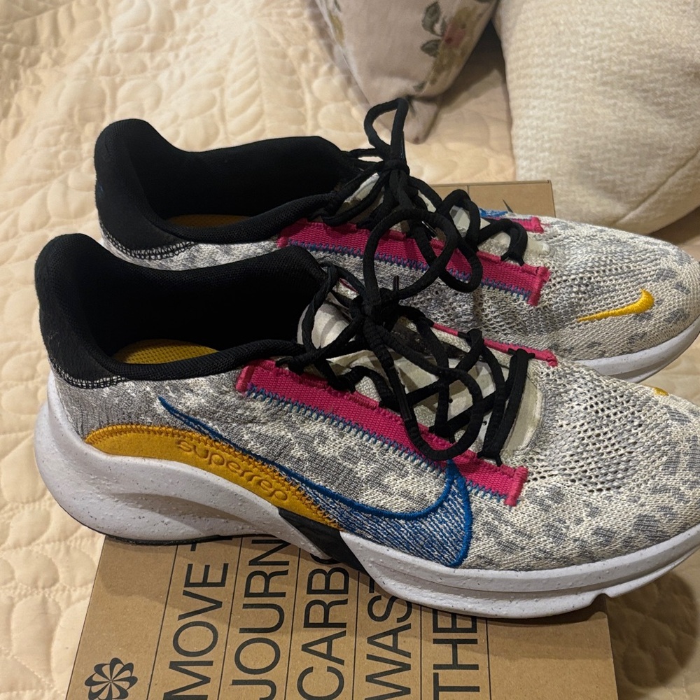 Nike Women's Gray Athletic Shoes with Blue and Yellow Accents